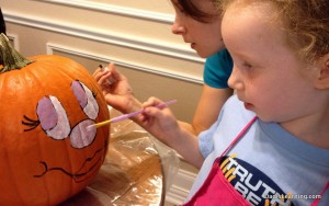 decorating a pumpkin