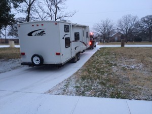 Our travel trailer being towed away on a snowy morning in Texas.